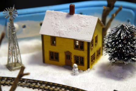 snowman by farm house
